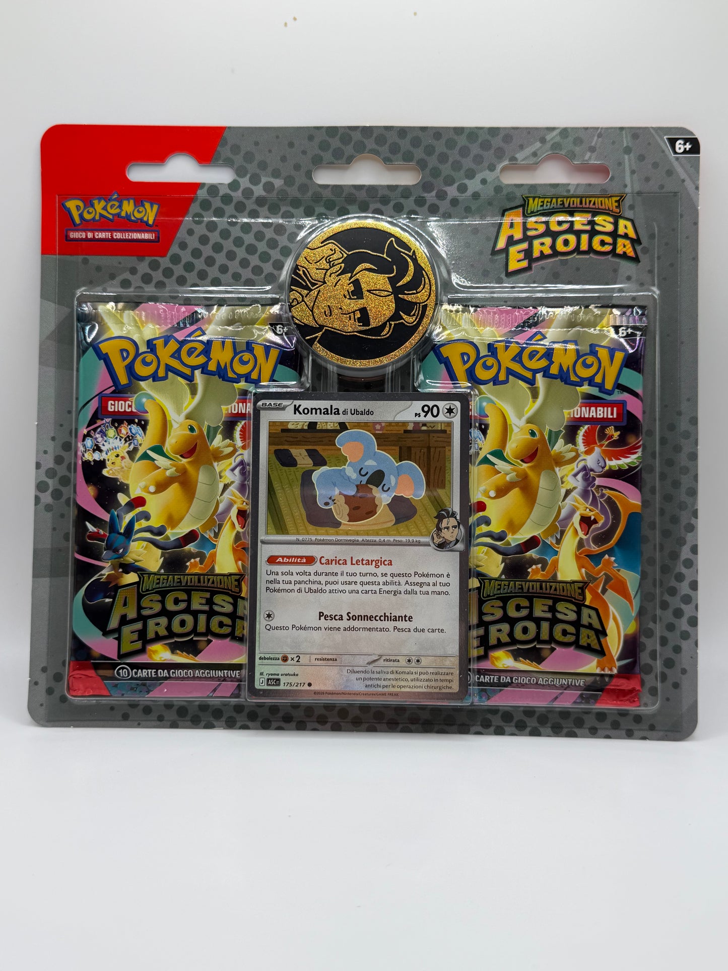 JCC Pokémon: Blíster de 2 paquetes de Komala de e-Nigma - Ascenso Heroico de Megaevolución